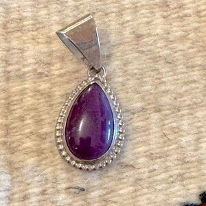 amethyst and Sterling pendant. Drop is 1 inch, pendant link is 1/2 inch. Likenew